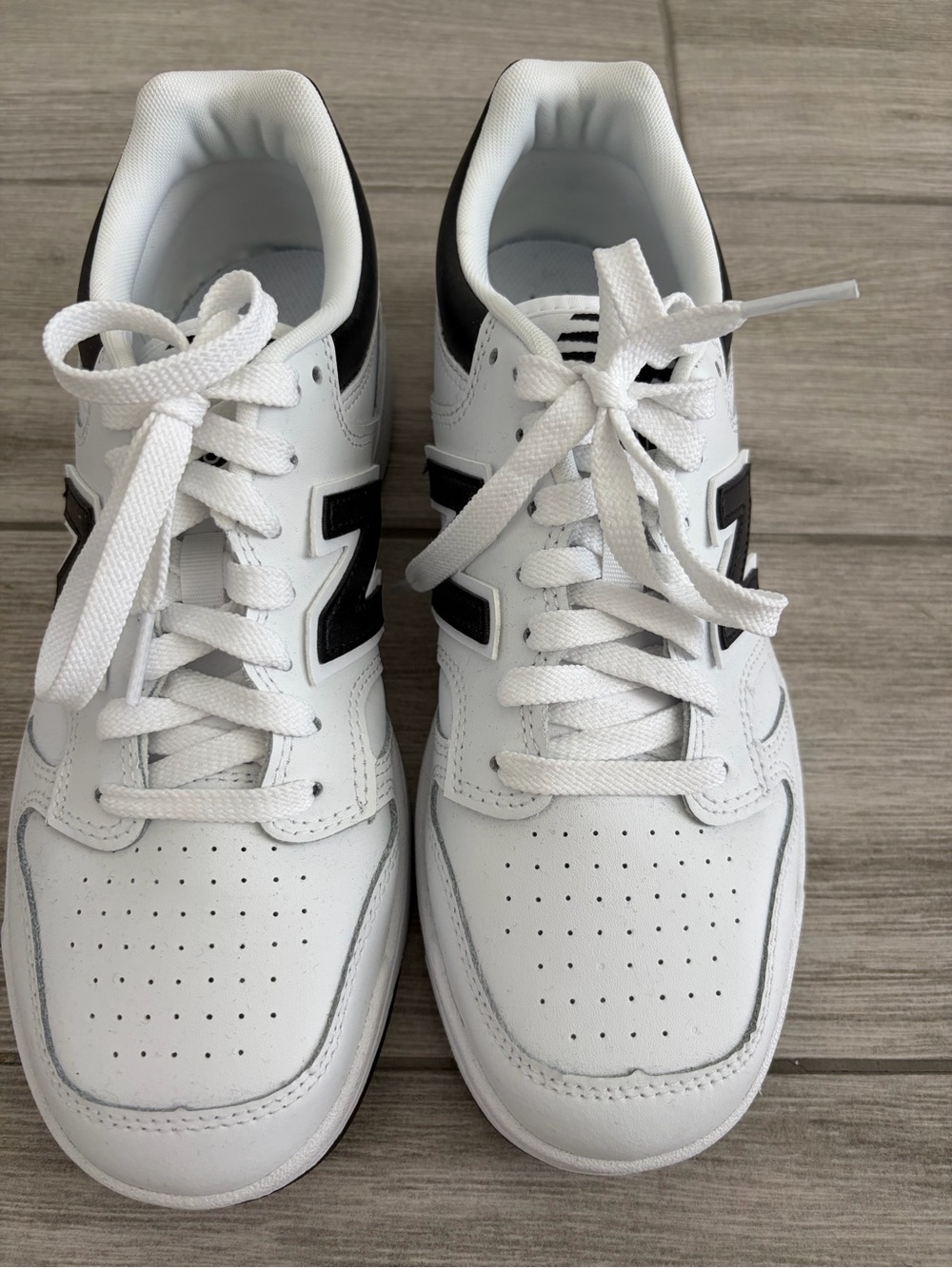 New Balance White Sneakers with Black Logo Accent